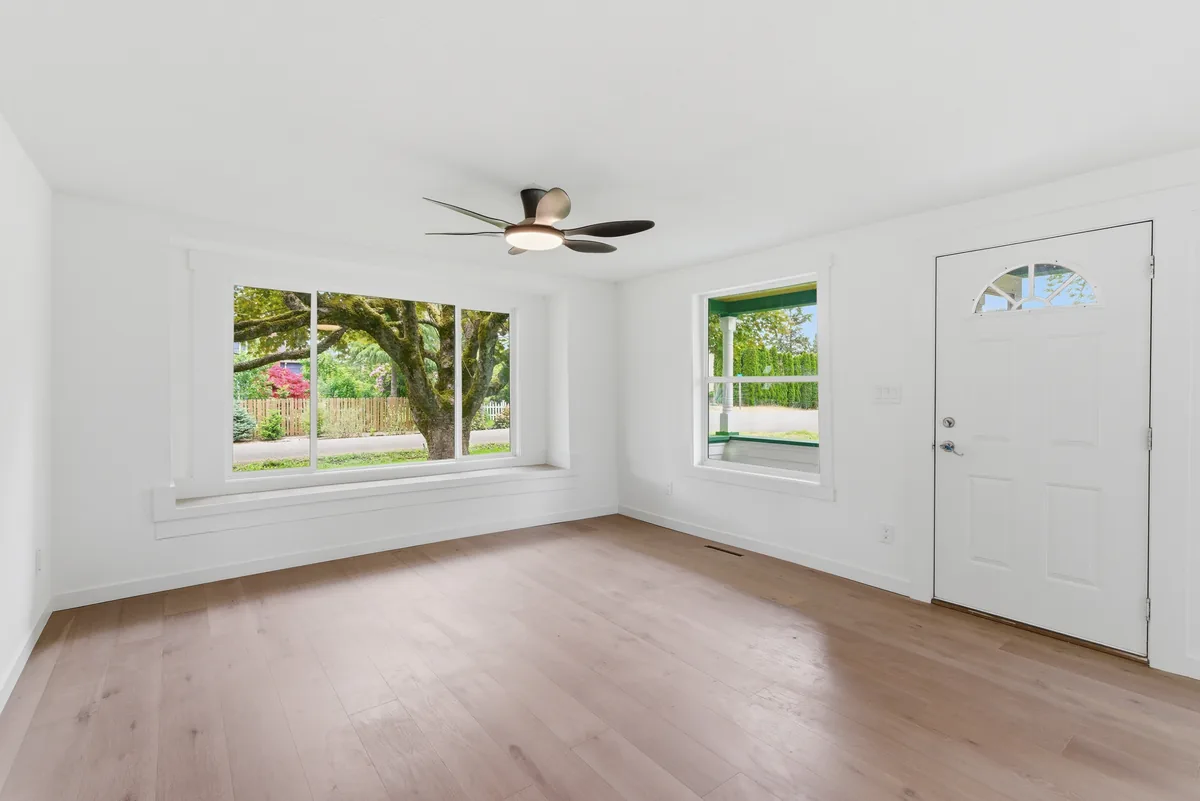 Open-plan flooring. Flooring carried across an open plan, seams and direction planned around the light.